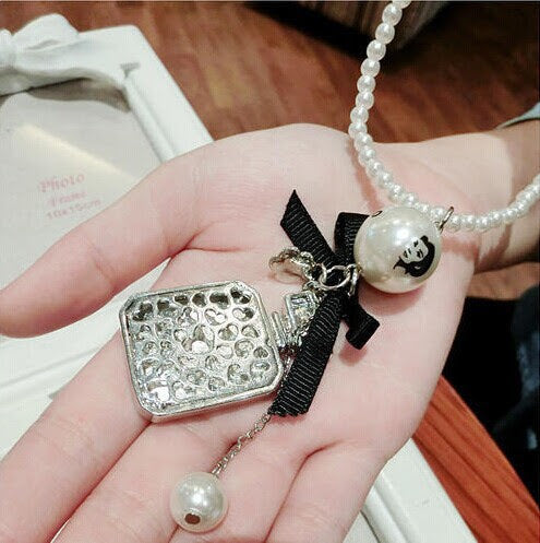 Perfume Bottle Shape Printed Number White Pearls With Little Black Bow